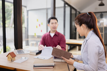 Real estate agents agree to buy a home, Agreement and customer discussing for contract concept.