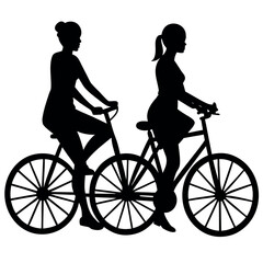 Two women silhouetted riding bicycles side by side