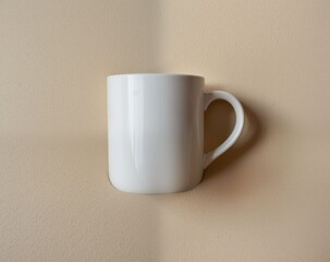 Obraz premium Clean White Ceramic Coffee Mug Against Soft Neutral Background