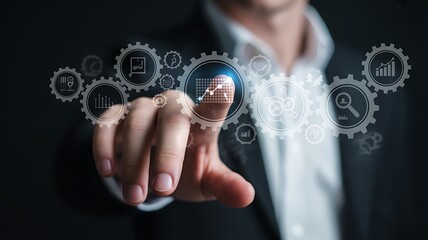 Businessman interacting with a digital interface of gears and business analytics technology