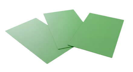 Three light green sheets layered against a black background.