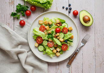 Top down shot of salad in plate on old table with pastel paint