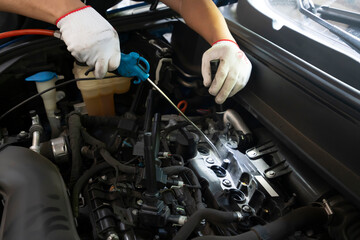 The repairman is repairing the car