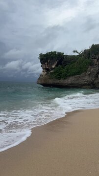 Gunung Payung, Nusa Dua, Fun and enjoyment of waves and sand on the beach. Lifestyle, vacation - summer, tropics.