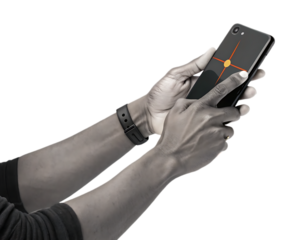 Person holding a black smartphone with a geometric design against a white graphic background design