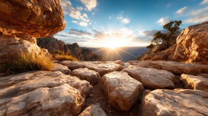 This dramatic image showcases rugged rocky terrain illuminated by the first light of dawn, with clouds dispersing, evoking a sense of adventure and the untamed beauty of nature.