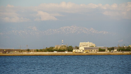Toyama Port under Blue Skies: Bridges and Sails over the Japan Sea