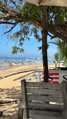 wooden sign on the beach