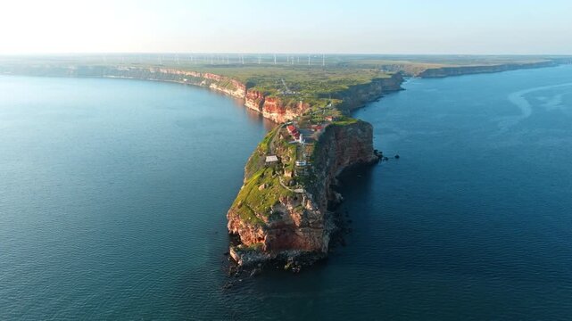 Drone aerial view of Cape Kaliakra reveals incredible summer colors stunning cliffs coastal stretch surrounded clear blue sea perfect natural scenery travel background history site Bulgaria seascape
