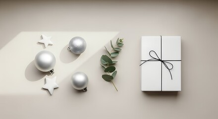 Minimalist christmas gift flat lay with silver ornaments, stars and Eucalyptus branch on a beige surface in soft light creating a festive Holiday atmosphere gift, present, white, silver, minimalist, e
