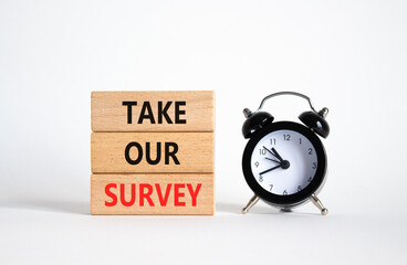 Take our Survey now symbol. Wooden blocks with words Take our Survey. Beautiful white background...