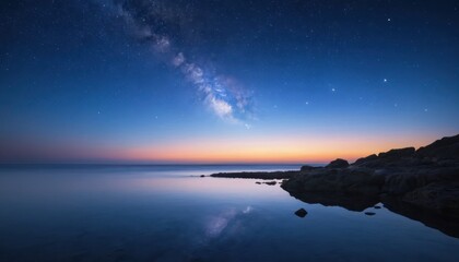 Night scene ocean rocks and stars Milky Way shines in the sky