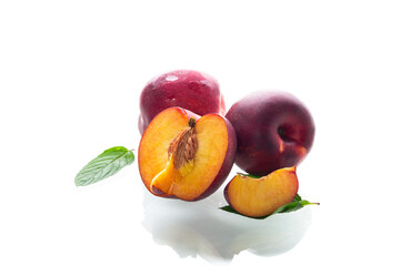 Ripe juicy nectarines isolated on white background