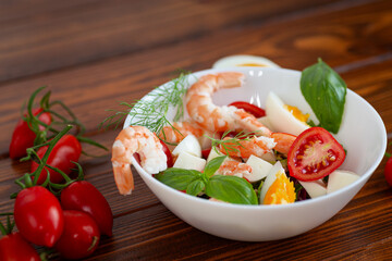 Healthy lunch with shrimp, cheese and fresh tomatoes