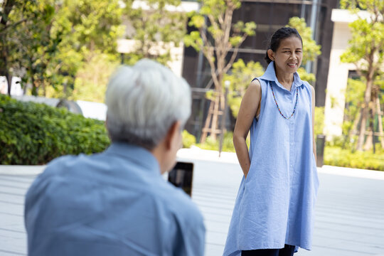 Lovely Senior couple, Asian Old Man Capturing Precious Moments with His elderly Wife Using a Smartphone - Powered by Adobe