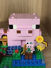 Fototapeta premium Large and Small Lego Minecraft Pigs with Accessories