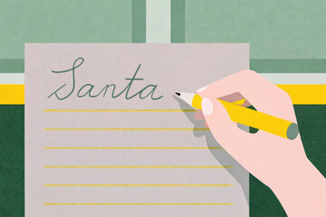 Writing a letter to Santa Claus during the holiday season at a cozy indoor setting