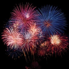 Red, white, and blue fireworks exploding in synchronized patterns