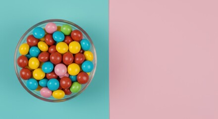 Obraz premium Vibrant candy coated chocolates in a glass bowl on a trendy two tone pastel background creates a sweet and colorful treat