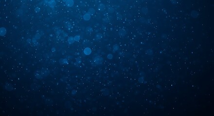 Fototapeta premium Abstract blue bokeh particles creating a magical underwater effect
