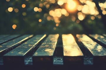 Sunset illuminates a wooden park bench, bokeh background of trees and golden light.