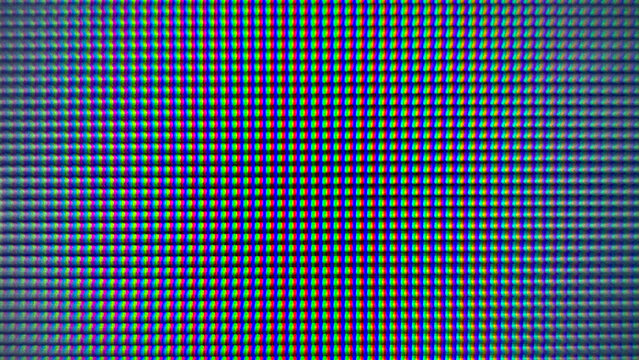Close-up macro shot of an LCD screen showing individual pixels and RGB subpixels, a digital background.