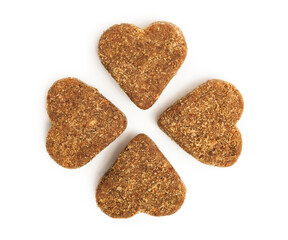 Treats in heart-shaped for cats or dogs. Group of brown soft chews for pets. Cookies or snacks to supplement diet with vitamins or medication. Selective focus. White background.	
