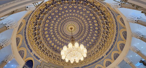 Grand Domed Ceiling with Intricate Patterns and Chandelier