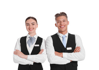 Smiling receptionists in uniforms with crossed arms on white background