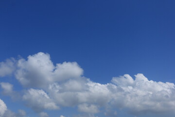 photo of a clear blue sky with beautiful white clouds
