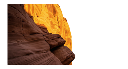 Sunlight highlights a canyon wall.