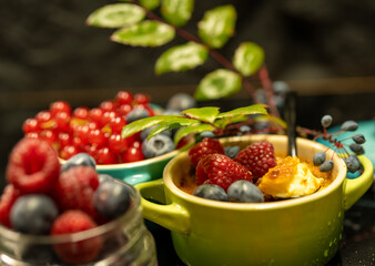 Dessert creme brylee with raspberries, unusual background. Home and restaurant food.