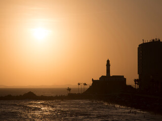 Salvador Bahia Brazil. Sunset silhouette of Barra lighthouse and coast