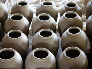 Unfinished clay pots drying