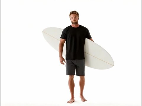 Surfer with Surfboard: A focused and determined surfer stands ready with his surfboard, the image is a study in preparation and anticipation, evoking a sense of adventure and the thrill of the waves.