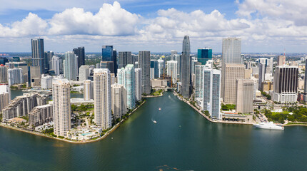Fototapeta premium Drone view of Brickell skyscrapers. Brickell cityscape of downtown Miami. Panoramic Miami Brickell skyline above the coastline. Brickell Key aerial view in Miami. Landscape of Miami.