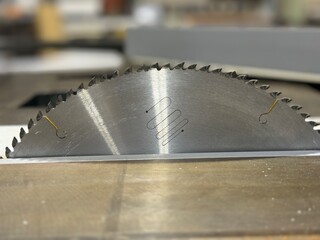Close up of circular saw cutting pvc board in workshop