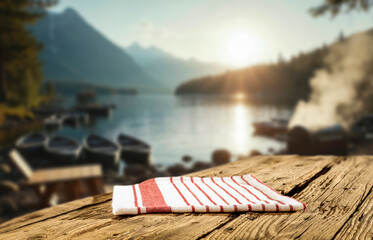 Rustic wooden table with copy space  for product placement or branding mockup. Scenic mountains and...