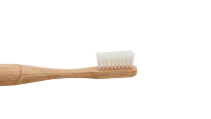 A natural bamboo toothbrush featuring soft bristles, emphasizing eco-friendly oral care.