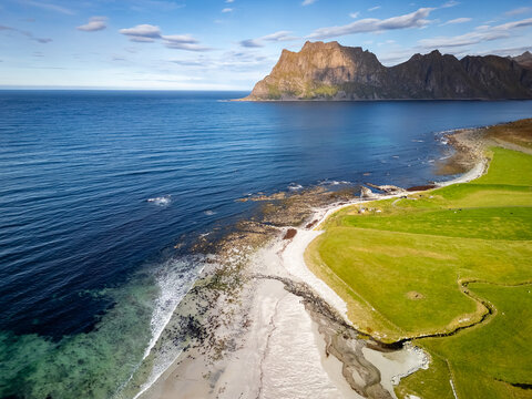 Aerial view of the Uttakleiv beach in Norway. One of the most famous locations on the Lofoten islands as seen from above.