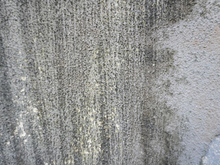 Gritty textured concrete surface background with subtle variations in tone and light