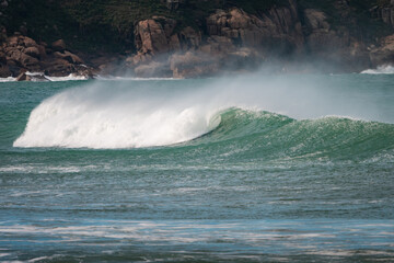 Waves of Praia do Rosa, Brasil. The power of the Atlantic after a huge storm. Big waves hitting the...