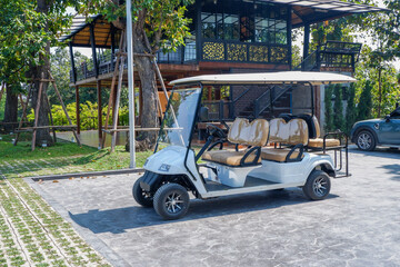 Golf cart at the golf course in Summertime,over nice green and blue sky,vacation and rest...