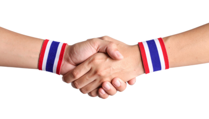Close-up of two hands in a handshake, each with a Thai flag wristband. The handshake symbolizes agreement and collaboration