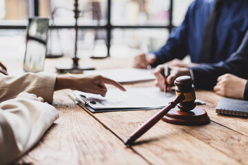 Lawyers and clients signing contract agreement after legal advice consultation. Lawyers and clients...