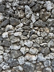 Rock wall, stacked rocks formed into wall in Bali, Indonesia. Rock texture