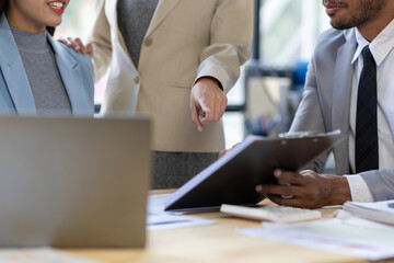 Meeting of businessmen and financial advisors analyzing financial report documents on work desk....