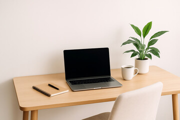Minimalist Home Office Workspace with Laptop, Coffee, and Green Plant
