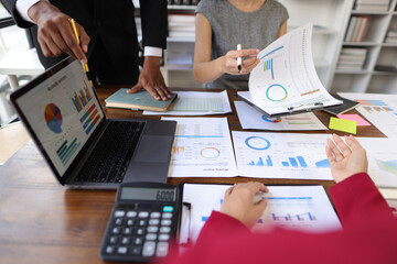 Meeting of businessmen and financial advisors analyzing financial report documents on work desk....