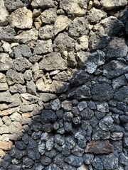 Rock wall, stacked rocks formed into wall in Bali, Indonesia. Rock texture